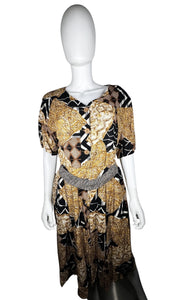 A vintage Norton McNaughton Petites 2-Piece Set with a abstract safari inspired button up short sleeve and skirt. Measured Flat TopChest - 40"Sleeve - 10"Length - 27" Bottom Waist - 30"Hips - 60" Length - 30"