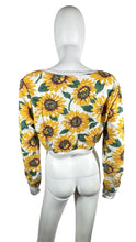 Load image into Gallery viewer, Bask in the sun with our 36 Point 5 Sunflower Sweatshirt. This cropped sweatshirt features a playful and quirky all-over sunflower print. Measured flat at 31&quot; chest, 24 1/2&quot; sleeves, and 16 1/2&quot; length. Perfect for adding a touch of fun to any outfit!