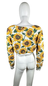Bask in the sun with our 36 Point 5 Sunflower Sweatshirt. This cropped sweatshirt features a playful and quirky all-over sunflower print. Measured flat at 31" chest, 24 1/2" sleeves, and 16 1/2" length. Perfect for adding a touch of fun to any outfit!