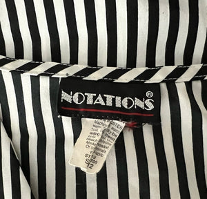 This Vintage Notations blouse features classic black and white pin stripes, perfect for adding a touch of retro charm to any outfit. Though it may be missing one button, the chest measures at a flattering 32 inches and the sleeves at a stylish 22 inche...