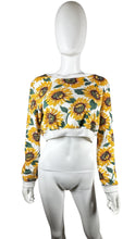 Load image into Gallery viewer, Bask in the sun with our 36 Point 5 Sunflower Sweatshirt. This cropped sweatshirt features a playful and quirky all-over sunflower print. Measured flat at 31&quot; chest, 24 1/2&quot; sleeves, and 16 1/2&quot; length. Perfect for adding a touch of fun to any outfit!