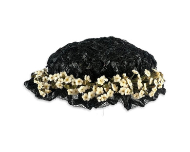 This vintage black hat by John Frederics features a beautiful basket weave and floral design. With a diameter of 7