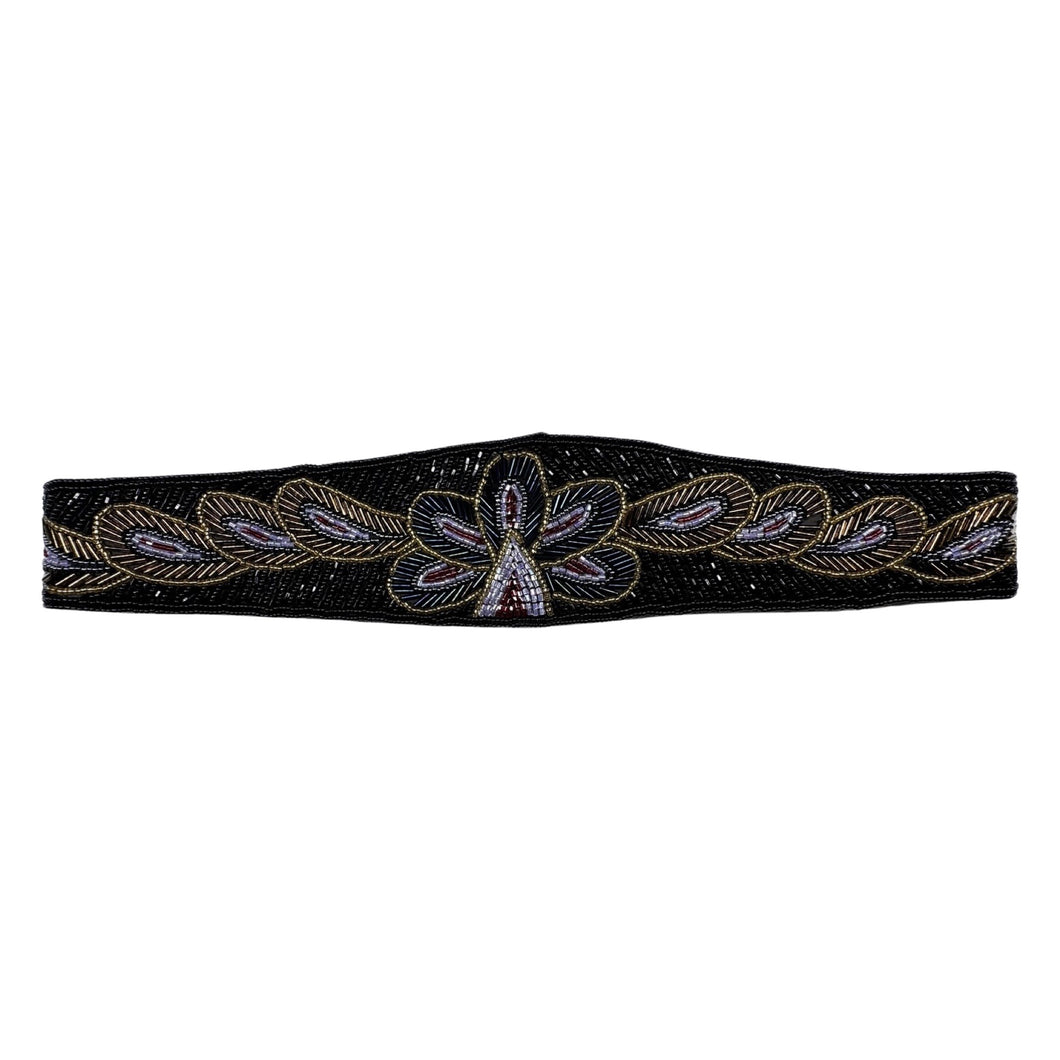 This waist belt is the perfect combo of vintage chic and playful fun! Featuring a black, hand-beaded design with a gleaming iridescent and gold floral pattern, it measures a cool 31 1/2 inches and attaches with a convenient Velcro assembly.