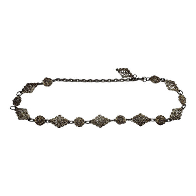 A silver gold vintage floral chain link belt from the 80's measuring at 41 inches.