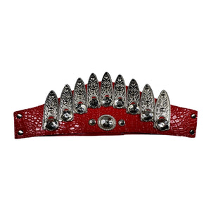This red vintage belt has adjustable velcro and metal feathers adorned with clear rhinestones for a unique look. Measures 31 inches in full length and 4.5 inches in width.