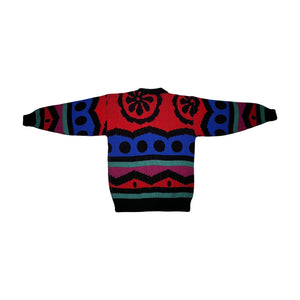 Experience vibrant warmth and charm with the one-of-a-kind Vintage La Vista Knitted Sweater, available in sizes small to medium. Measured flat, the chest is 36 inches, the sleeves are 16 inches, and the length is 24 inches. Fall in love with the playfu...