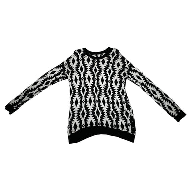 Experience the versatility of our black and white patterned geometric sweater - wear it as a dress with tights underneath or pair it with your favorite bottoms for a stylish look! Measured Flat Chest -36