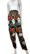 Load image into Gallery viewer, The Vintage Léger Floral Pant features a bold floral print, making a statement with its 100% Rayon fabric. With a high waisted fit, it measures 26&quot; around the waist and has a comfortable 28&quot; inseam. Its chic harem style and length of 41&quot; make it a unique addition to any wardrobe.