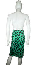 Load image into Gallery viewer, The Vintage Lush Leopard Print Skirt is a green fitted stretchy pencil skirt featuring an all-over leopard print, a front slit, and a measurement of 24&quot; waist and 30&quot; hips with a length of 23 1/2&quot;. Perfect for medium to smaller large sizes!