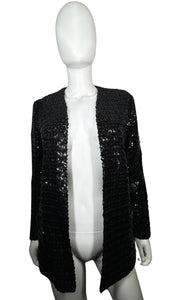 Experience the dazzling beauty of our Vintage ILGWU Sequin Blazer, crafted by the renowned International Ladies Garment Workers Union. This stunning black blazer features measurements of 34" chest, 23" sleeves, and 27" length in size 11, and 33" chest,...