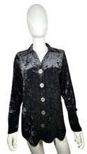 Load image into Gallery viewer, This vintage Harve Benard by Senard Holtzman Button Up features a sleek black crushed velvet material, creating a cozy cardigan style with a touch of glamour. Measured flat, its chest is a perfect 38 inches and its sleeves extend to 23 inches, while it...