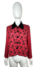 Load image into Gallery viewer, Introducing the Vintage J.W. Treci Blouse: a playful red crop with a velvet collar and a charming rose print on the front. This versatile top can even double as a blazer! Get your quirky on with a chest measurement of 39&quot;, sleeve length of 21&quot;, and ove...