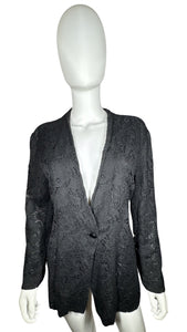 This one-button blazer from Vintage Linda Allard for Ellen Tracy adds a touch of lace to your wardrobe. It measures flat at 42" for the chest, 21" for the sleeves, and 28" in length. Just the right amount of vintage charm!