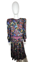Load image into Gallery viewer, Vintage Patty O&#39;neil by Monique Robidoux Floral Dress is a purple long sleeve dress with an all over floral print and built in suede belt. Measured Flat Chest - 38&quot; Sleeve - 25&quot; Waist - 26&quot; Hips - 34&quot; Length - 49&quot;