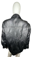 Load image into Gallery viewer, Vintage 80&#39;s Genuine Black Leather Jacket that zips and buttons that is in excellent condition. Measured Flat Chest - 42&quot; Sleeve - 24&quot; Length - 31&quot;