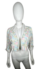 Load image into Gallery viewer, Pastel floral print crop jacket. Its a vintage size 10 so it runs smaller. Measured Flat Chest - 36&quot; Sleeve - 16 1/2&quot; Length - 17&quot;