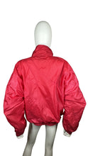 Load image into Gallery viewer, Experience the bold, vibrant red of this Vintage Metro Active wind jacket. Carefully crafted with a flat chest measurement of 42&quot;, sleeve length of 23&quot;, and overall length of 24&quot;. Don&#39;t miss out on this unique piece that combines fashion and function.