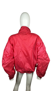 Experience the bold, vibrant red of this Vintage Metro Active wind jacket. Carefully crafted with a flat chest measurement of 42", sleeve length of 23", and overall length of 24". Don't miss out on this unique piece that combines fashion and function.