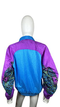 Load image into Gallery viewer, Experience the thrill of finding a rare gem with this Vintage Members Only Windbreaker Jacket. The 90&#39;s style jacket features vibrant purple and blue tones, with a convenient zip-up design. With a chest measurement of 40&quot;, sleeve length of 24&quot;, and ove...