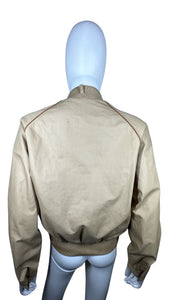 This Vintage Members Only Jacket comes in a beautiful tan and brown color and features a reversible zip-up design with two buttons. Measured Flat Chest - 32" Sleeve - 24" Length - 24".