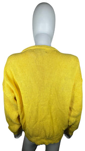 Indulge in the timeless charm of this bright yellow cardigan sweater, with its stylish knitted design, classic button-up closure, and flattering measurements of 42" chest, 19" sleeves, and 24 1/2" length. You'll love the way it looks and feels, allowin...