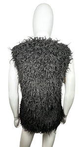 The H&M Black Faux Fur vest comes with pockets, measuring 32" in the chest and 24" in length.
