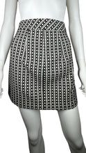 Load image into Gallery viewer, This Express skirt comes in a size 2 and features a fun black and white pattern with a bold gold zipper in the front. When laid flat, it measures 26&quot; at the waist, 36&quot; at the hips, and has a length of 24&quot;.