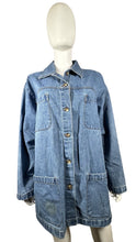 Load image into Gallery viewer, Keep it casual and cool in this Cabin Creek Oversized denim jacket. It may have a little &quot;character&quot; stain on the front right pocket, but it only adds to the charm. Measured at a flat 50&quot; chest and a length of 31 1/4&quot;, this is the perfect piece for a r...