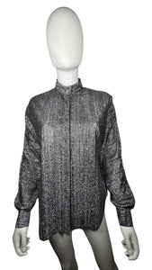 Experience the ultimate 70's vibe with this shiny sparkly Lame' lurex fabric silver button party top from Judy Bond. Don't let the pictures deceive you, it's even better in person. Measured Flat Chest - 38" Sleeve - 25" Waist - Length - 29".