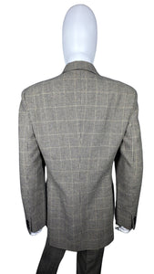 A unique throwback Liz Claiborne collection featuring a luxurious wool tweed suit adorned with houndstooth pattern. This suit comes with a blazer and pants set, with measurements of blazer chest at 30 inches, sleeve at 23 inches, and length at 29.5 inc...