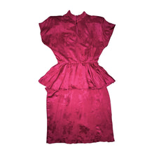 Load image into Gallery viewer, An 80’s vintage bright pink peplum dress with floral print on the silk.    Measured Flat  Chest- 32”  Waist- 26”  Hips- 36”  Length- 41”