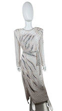 Load image into Gallery viewer, This stunning dress is a one-of-a-kind gem from the 80&#39;s, embellished with shiny beads and a delicate, blush pink color. The stylish, form-fitting shape is highlighted by a dazzling, bedazzled belt. Measurements: Bust - 30&quot; Sleeves - 23 1/2&quot; Length - 5...