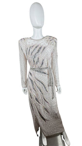 This stunning dress is a one-of-a-kind gem from the 80's, embellished with shiny beads and a delicate, blush pink color. The stylish, form-fitting shape is highlighted by a dazzling, bedazzled belt. Measurements: Bust - 30" Sleeves - 23 1/2" Length - 5...