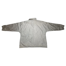 Load image into Gallery viewer, Experience the unbeatable style and functionality of the Vintage Cabin Creek windbreaker in the on-trend color of tan. With measurements of 42&quot; for the chest, 26&quot; for the sleeves, and a length of 31&quot;, this oversized jacket is the perfect addition to an...