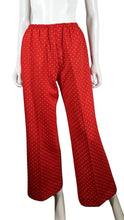 Load image into Gallery viewer, Add a touch of vintage flare to your wardrobe with these 70&#39;s Act lll pants. Made with polyester, they feature a stretchy waist and a playful all-over diamond print in white. Plus, they have a union-made label for added value. Measured flat, they have...