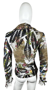 Experience the timeless elegance and charm of the Vintage Alberto Makali jacket. This designer piece features an abstract floral design, mesh sleeves, and a unique tie detail that adds a touch of sophistication. The jacket measures 30" in the chest, 28...