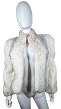 Load image into Gallery viewer, Experience the luxurious warmth and style of this stunning Vintage Dyed Rabbit Fur Coat from the 80&#39;s. With its unique white and grey color combination and elegant button detailing, this coat is sure to make a statement. Measured flat, the chest measur...