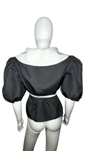 Elevate your wardrobe with this stunning Vintage Designer Couture Tally Boutique Taffeta blouse. Its timeless black and white color scheme and tie belt add a touch of sophistication to any outfit. And with measurements of 35" chest, 14" sleeves, and 24...