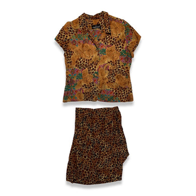 Complete your chic look with this Vintage Carole Little Petites shirt and skirt combo, featuring a stylish leopard and floral print. 