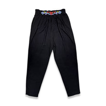 Load image into Gallery viewer, Introducing the Black Tribal Pant: a high-waisted harem style pant with tribal-inspired embroidery along the waistline. With a stretchy waistband in the back, you&#39;ll feel comfortable and stylish all day long. Measured flat, the waist is 29 inches, the...