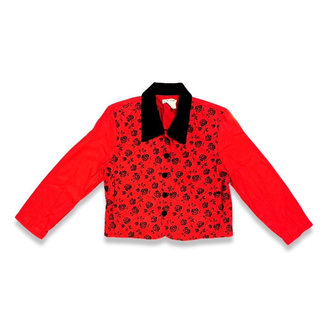 Introducing the Vintage J.W. Treci Blouse: a playful red crop with a velvet collar and a charming rose print on the front. This versatile top can even double as a blazer! Get your quirky on with a chest measurement of 39