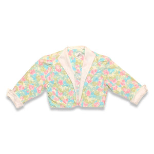 Pastel floral print crop jacket. Its a vintage size 10 so it runs smaller. Measured Flat Chest - 36" Sleeve - 16 1/2" Length - 17"