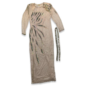 This stunning dress is a one-of-a-kind gem from the 80's, embellished with shiny beads and a delicate, blush pink color. The stylish, form-fitting shape is highlighted by a dazzling, bedazzled belt. Measurements: Bust - 30" Sleeves - 23 1/2" Length - 5...