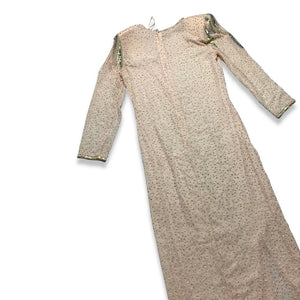 This stunning dress is a one-of-a-kind gem from the 80's, embellished with shiny beads and a delicate, blush pink color. The stylish, form-fitting shape is highlighted by a dazzling, bedazzled belt. Measurements: Bust - 30" Sleeves - 23 1/2" Length - 5...