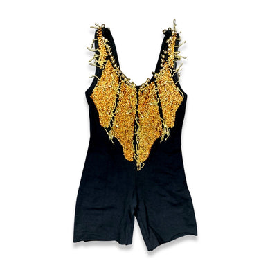 This Vintage Black and Gold Beaded Leotard has a stretchy and comfortable feel. Although it may show some wear and tear, it still holds its unique charm with a few holes and a missing bead on the chest. In the past, I had a skirt attached to the back t...