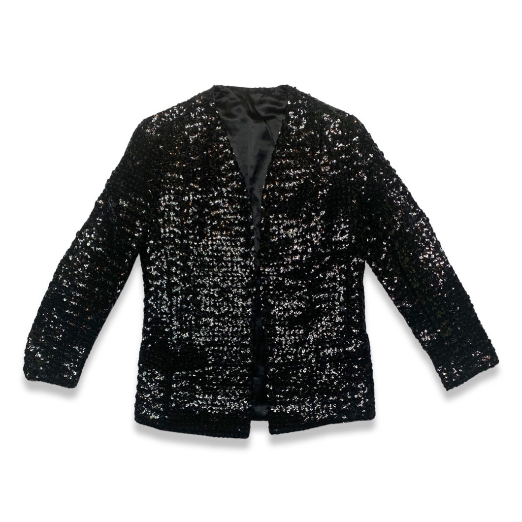 Experience the dazzling beauty of our Vintage ILGWU Sequin Blazer, crafted by the renowned International Ladies Garment Workers Union. This stunning black blazer features measurements of 34