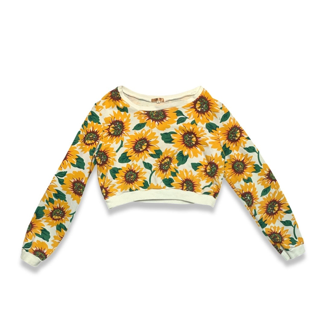 Bask in the sun with our 36 Point 5 Sunflower Sweatshirt. This cropped sweatshirt features a playful and quirky all-over sunflower print. Measured flat at 31